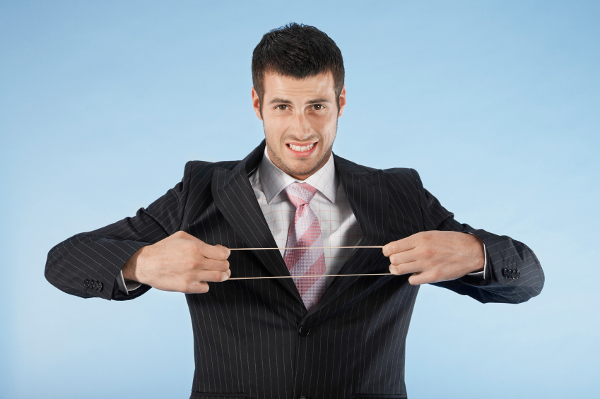 Businessman Stretching Rubber Band